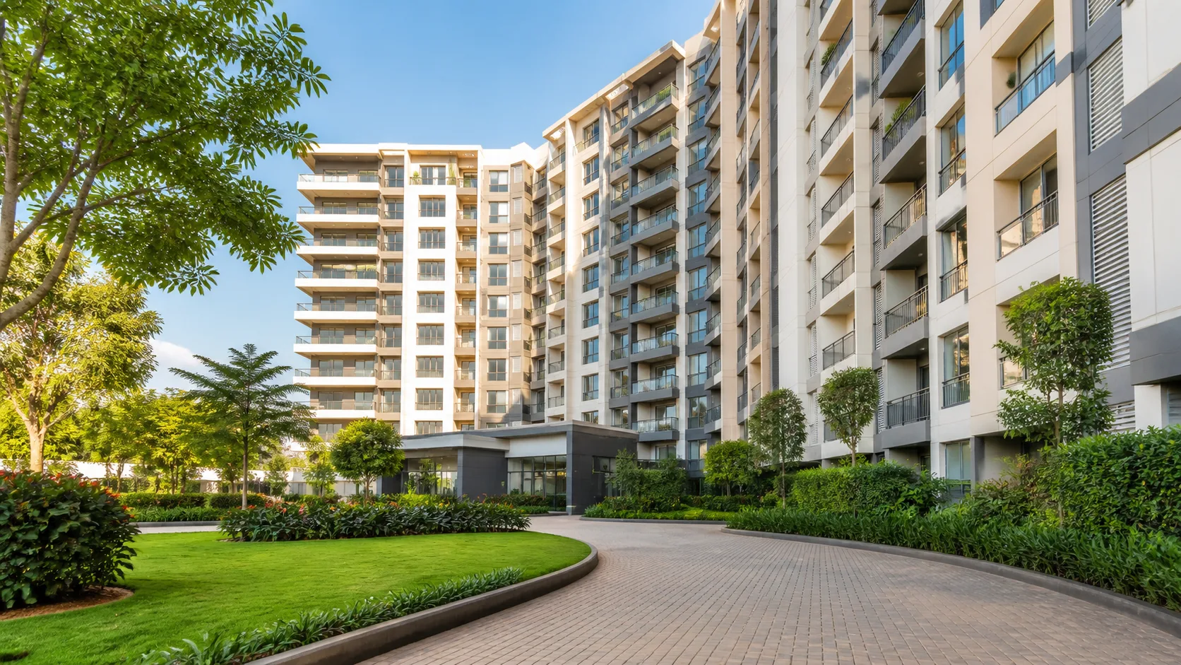 Illustration: Mid-rise apartment towers with a landscaped lawn and driveway, Nashik